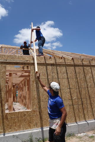 Passing trusses up. 